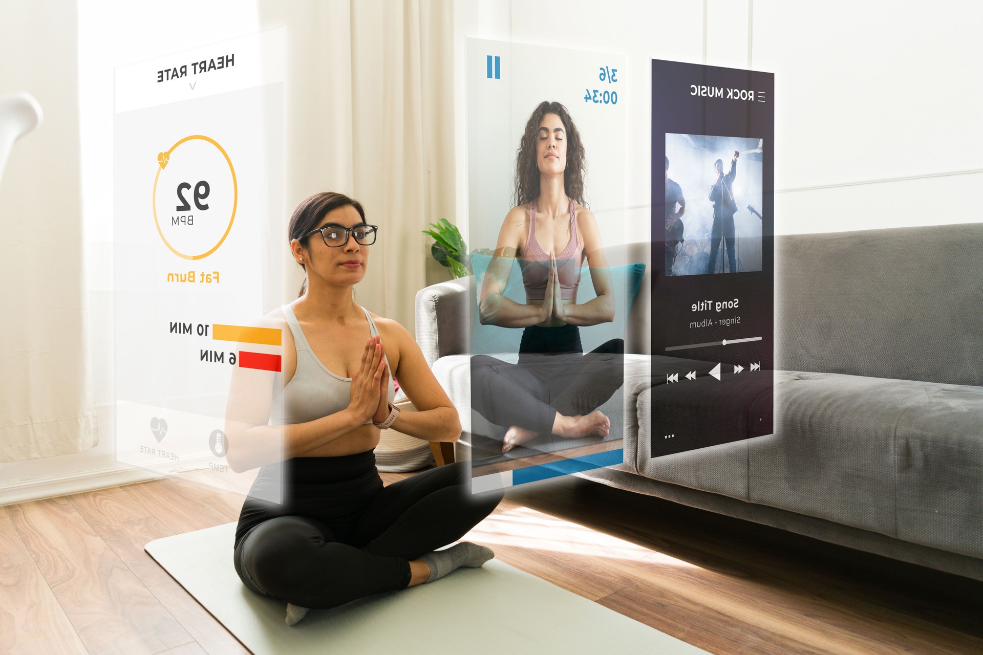 Female performing yoga at home, wearing AR glasses, engaging with floating fitness screens and digital content
